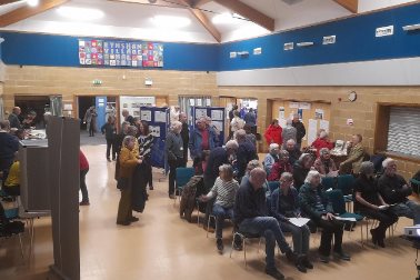 APM 2026 main hall - Village Hall with chairs and people seated - Photographer Michelle Legg